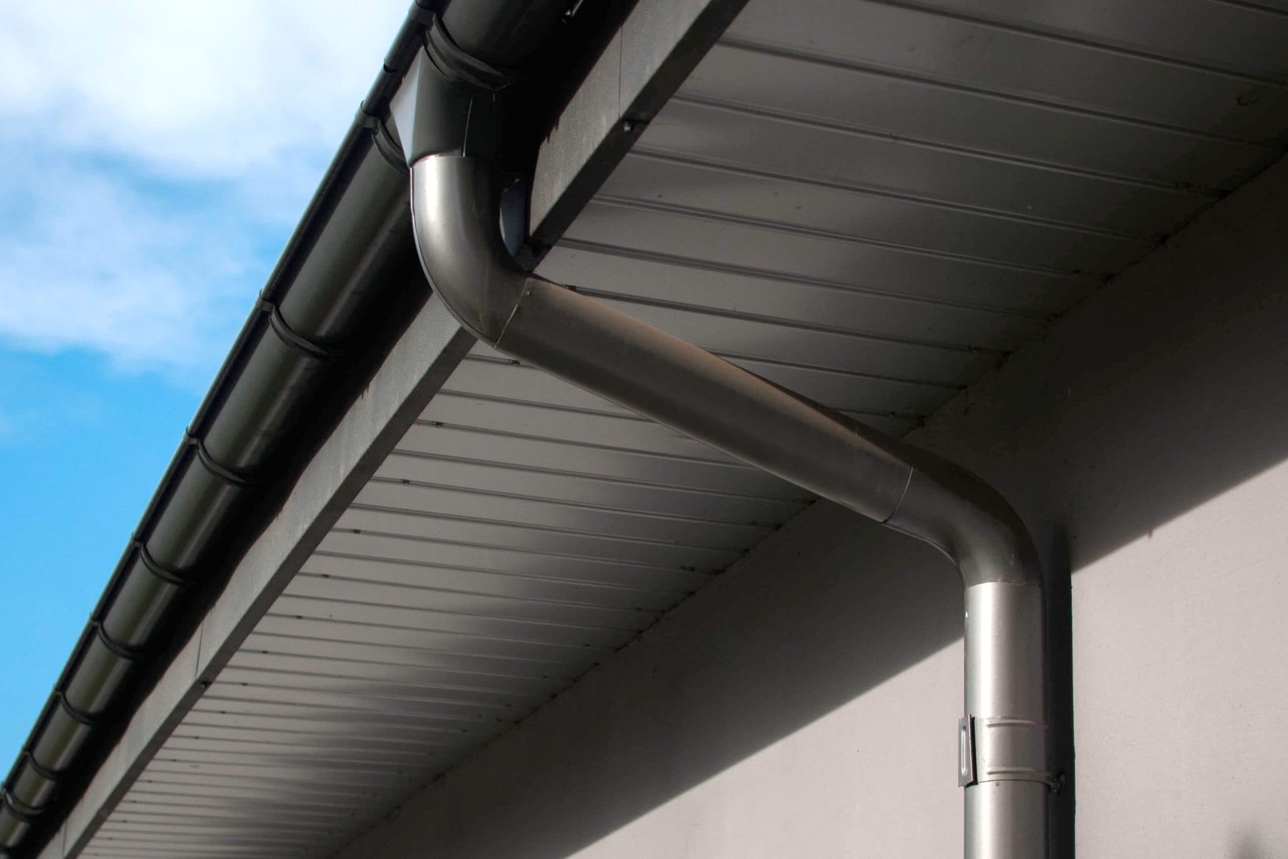 Corrosion-resistant galvanized gutters installed on a commercial building in Dallas